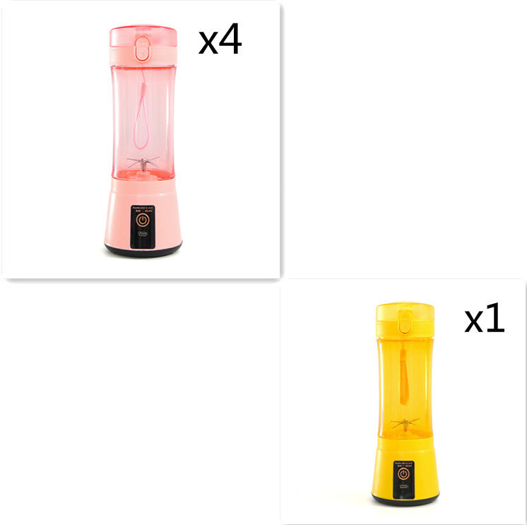 Portable electric fruit juicer with pink and yellow blender cups