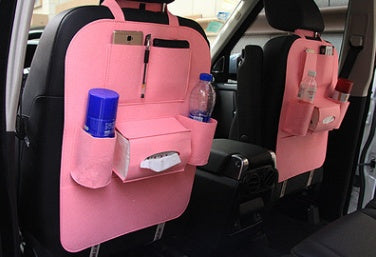Light pink seat organizer bag with front pockets and bottle holder sleeve