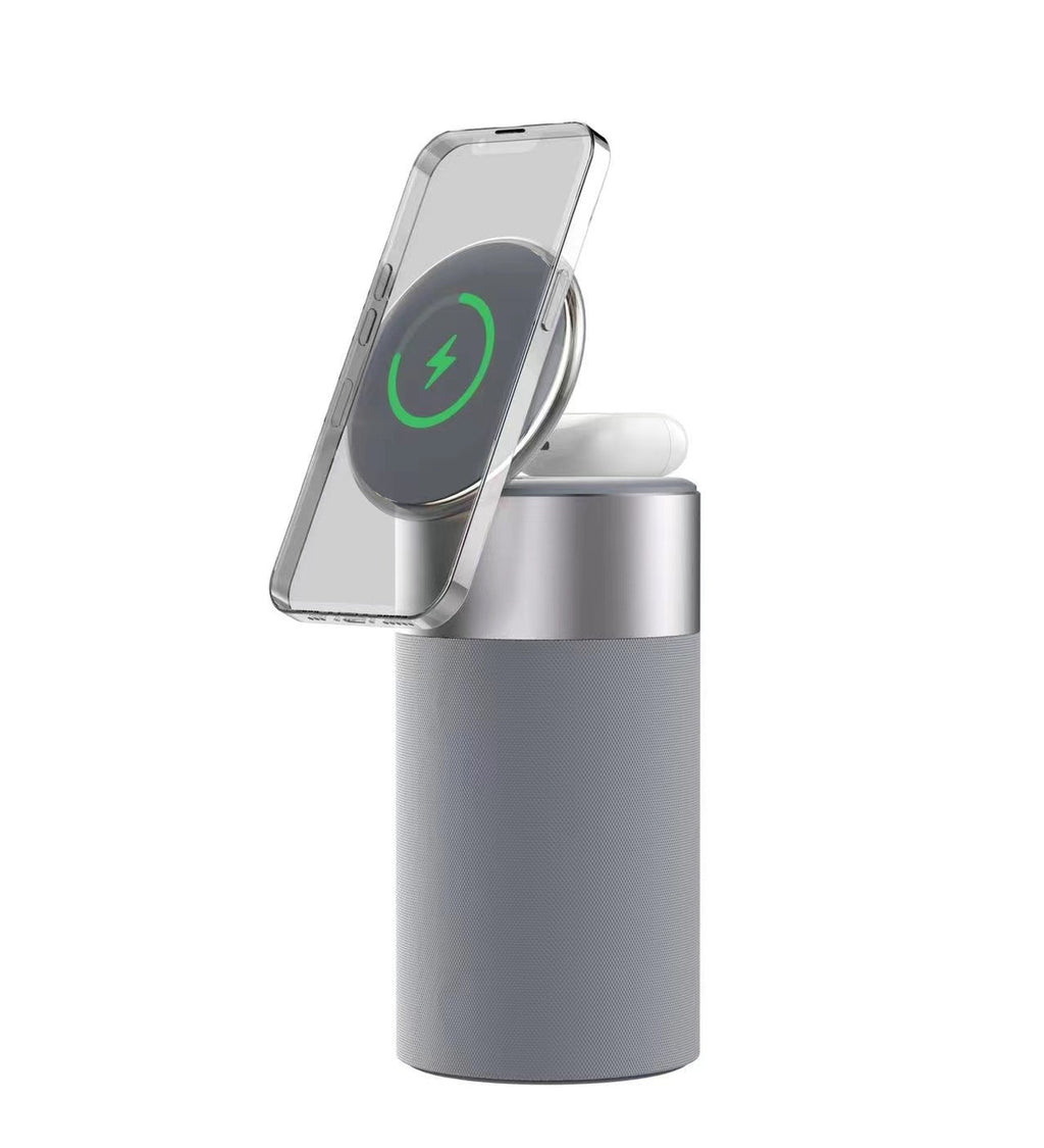 Wireless charging dock with phone stand, wireless pad, and earbuds on dark gray base