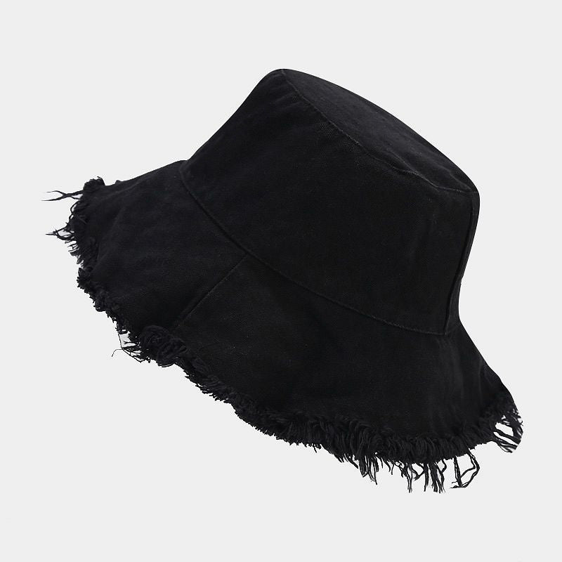 Black sun hat with wide brim and fringed fray detail around the edge.