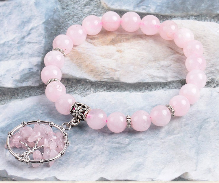 Pink crystal beaded bracelet with round rose quartz pendant and silver bead spacer charm
