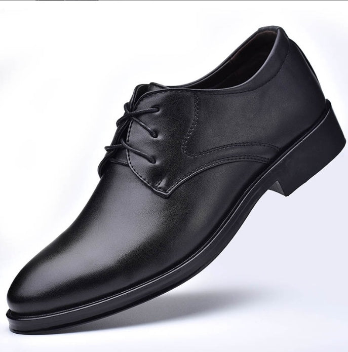 Men's pointed-toe lace-up dress shoes, black leather upper with stitched V seam.
