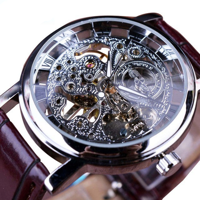 Mechanical watch with silver-tone openwork dial and maroon leather strap