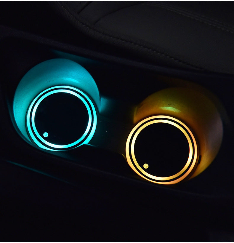 Two LED light-up coasters with teal and amber circular LED rings