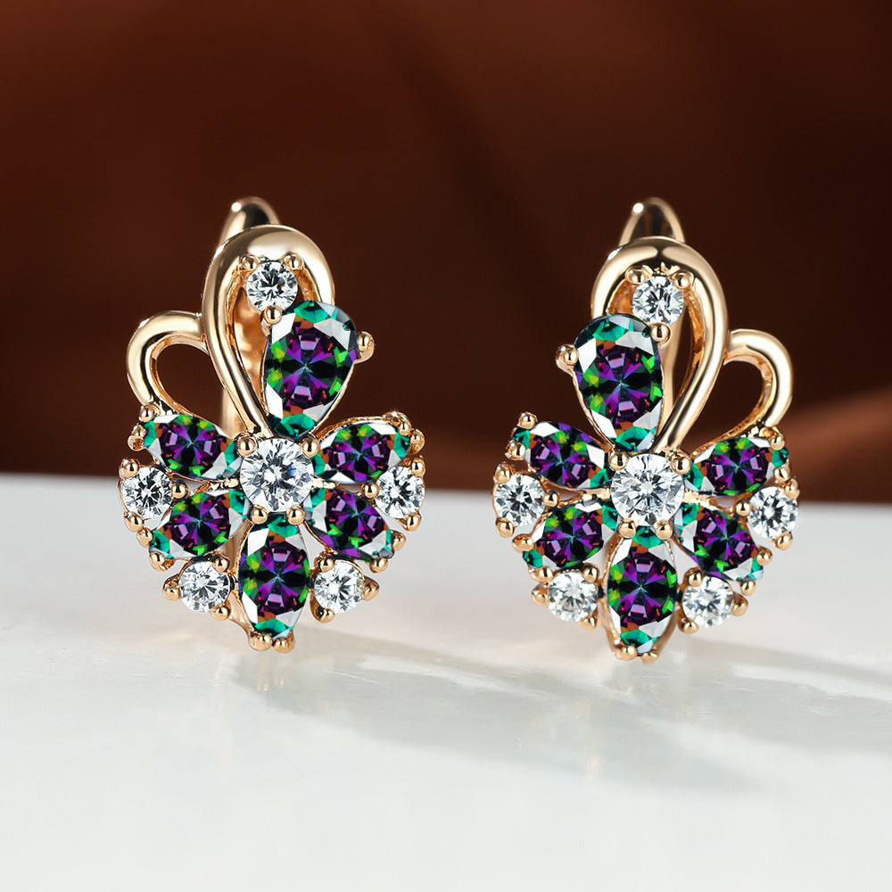 Gold-tone drop earrings with multicolor purple and green stones, clear round accents