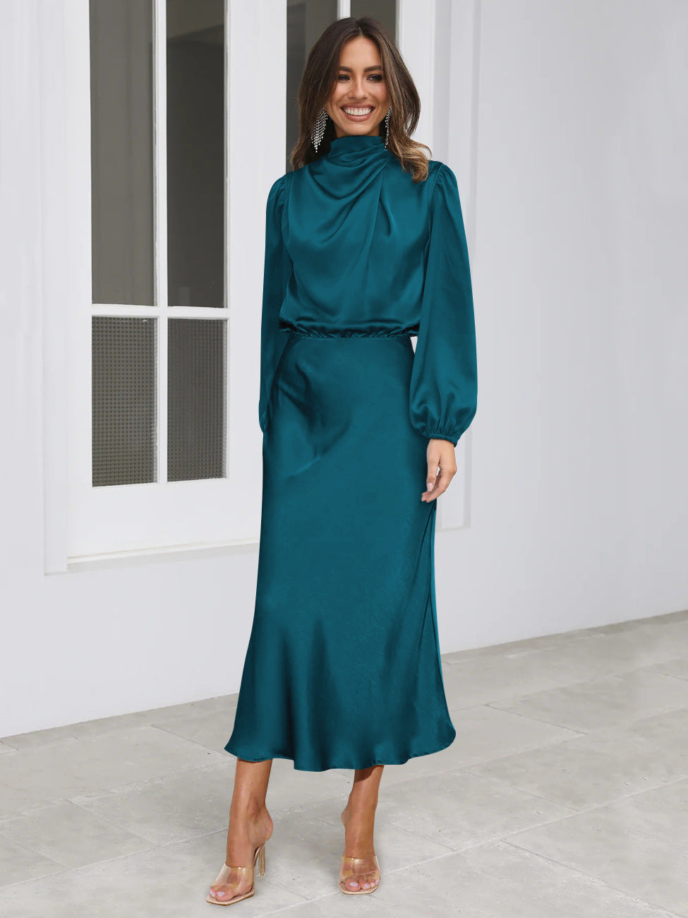 Teal long-sleeved satin midi dress with high neck and gathered waist