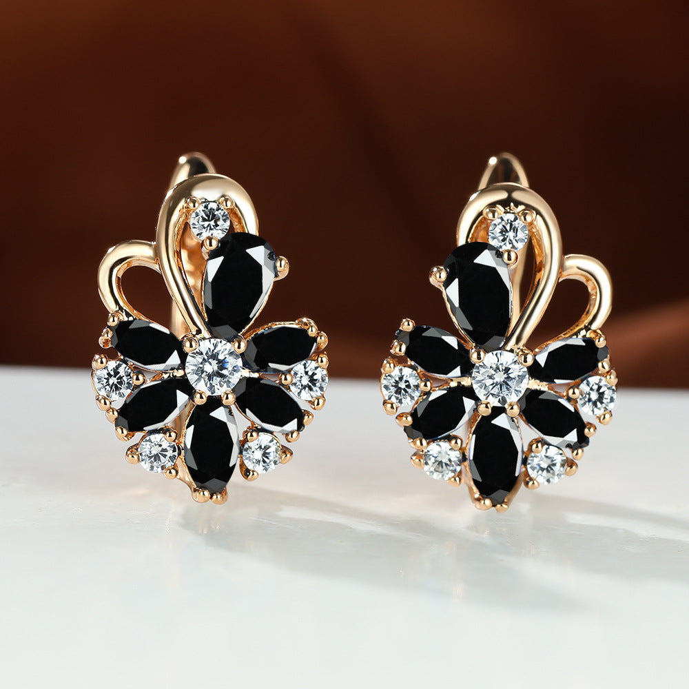 Gold flower drop zircon earrings with black and clear stones