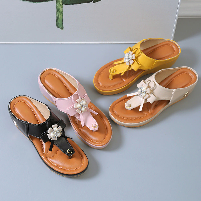 Women’s flower wedge platform flip flops set: black, pink, white, and yellow with flower accents