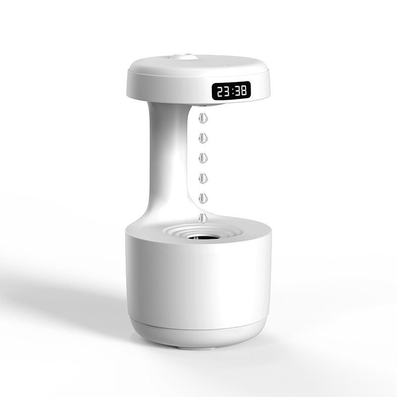 White cool mist humidifier with LED clock display and suspended water droplets.