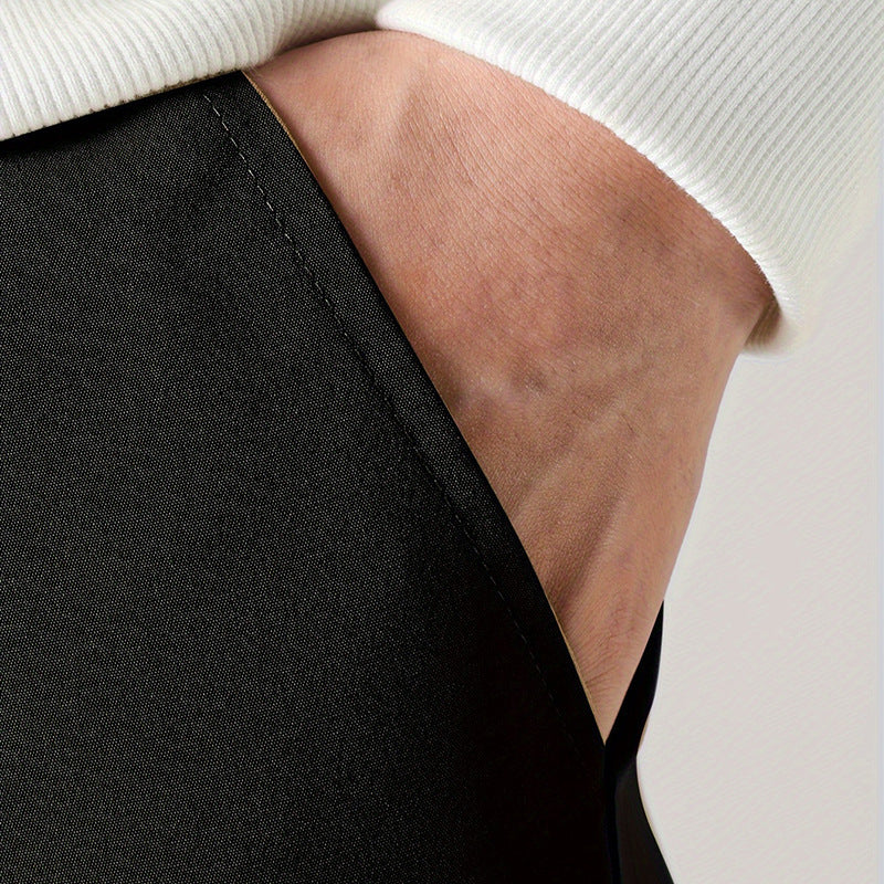 Close-up of black fabric with visible seam at the ankle cuff