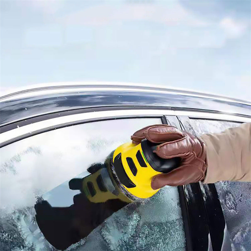 Yellow cordless electric snow scraper with black pad, pressed against snowy windshield