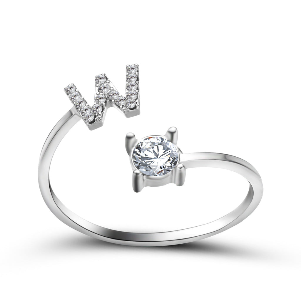 Silver adjustable initial letter ring with pave letter detail and oval center stone.
