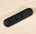 Black silicone cable organizer bar with evenly spaced clip pegs
