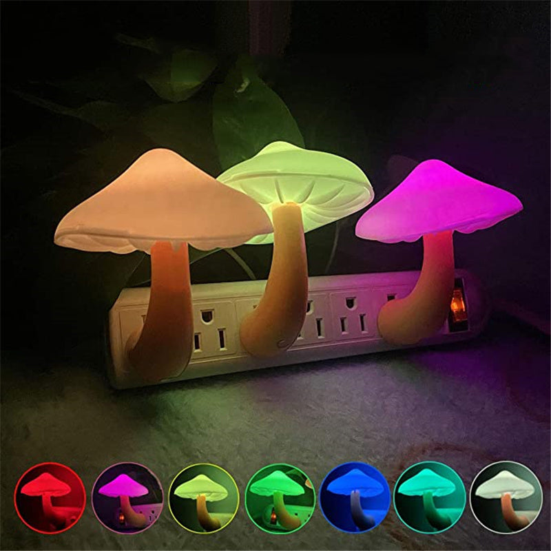 Colorful plug-in mushroom LED night lights on outlet strip with bright glowing caps