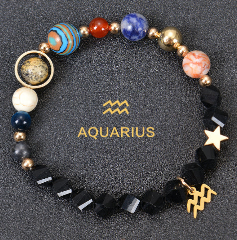 Zodiac beaded bracelet with black faceted beads, gold spacers, Aquarius charm and star