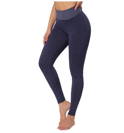 Navy blue seamless high-waist leggings with textured honeycomb pattern, full length