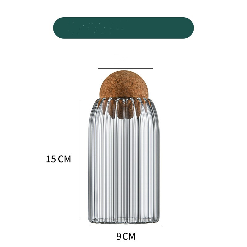 Ribbed glass display bottle with cork lid, 15cm tall and 9cm wide