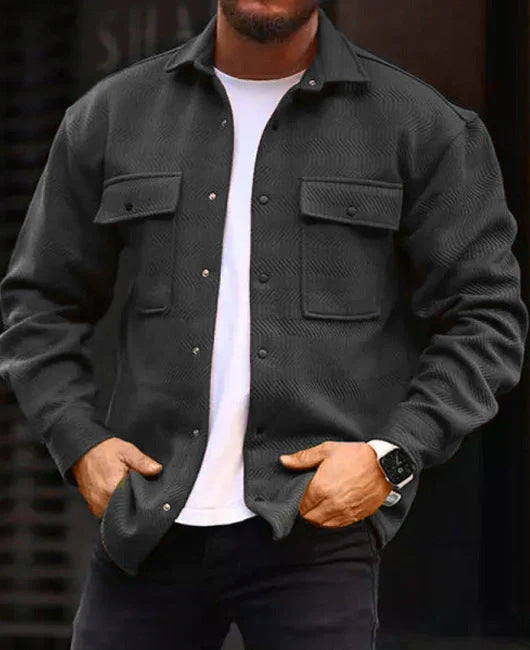 Men's polo-collar coat shirt in charcoal gray with button front and flap chest pockets.
