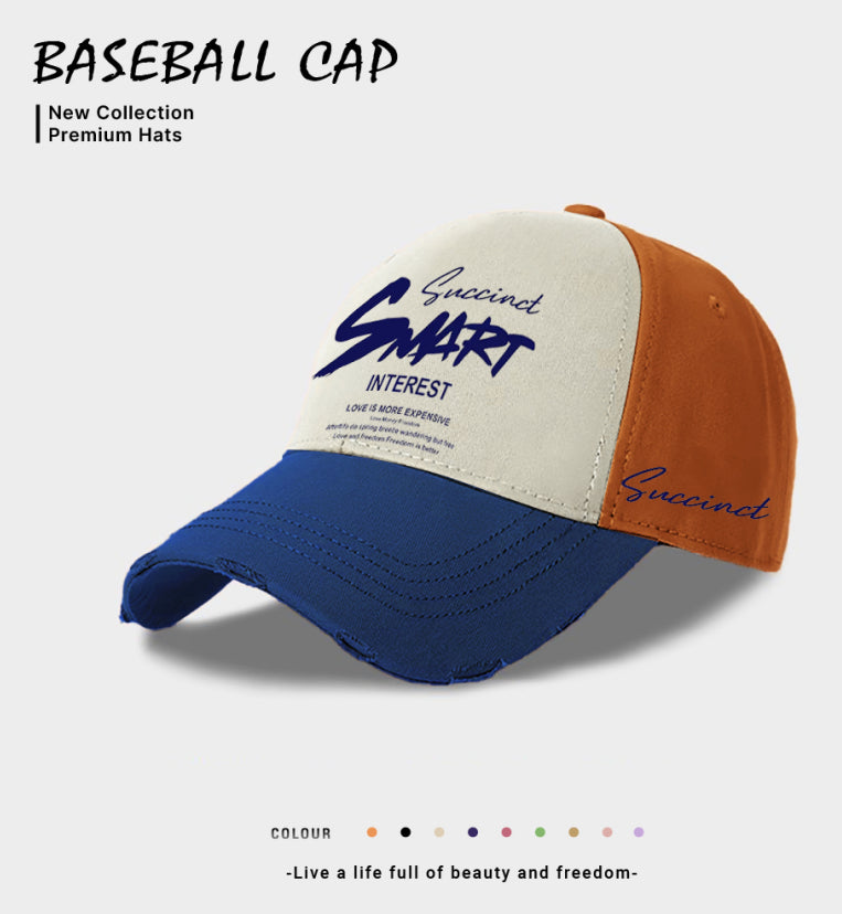 Two-tone baseball cap: cream top, blue front panel with orange side and logo