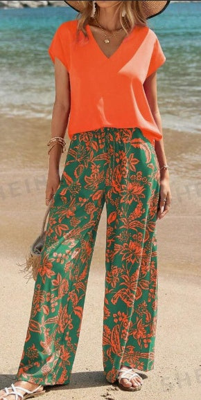 V-neck short-sleeve top and floral wide-leg pants, orange top with green print