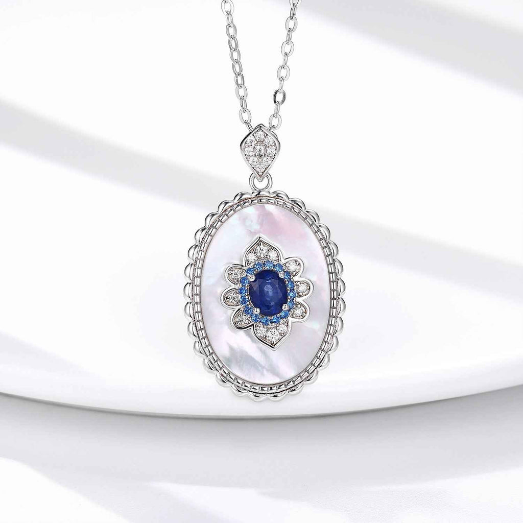 Oval sapphire diamond pendant necklace in sterling silver with blue center stone and chain