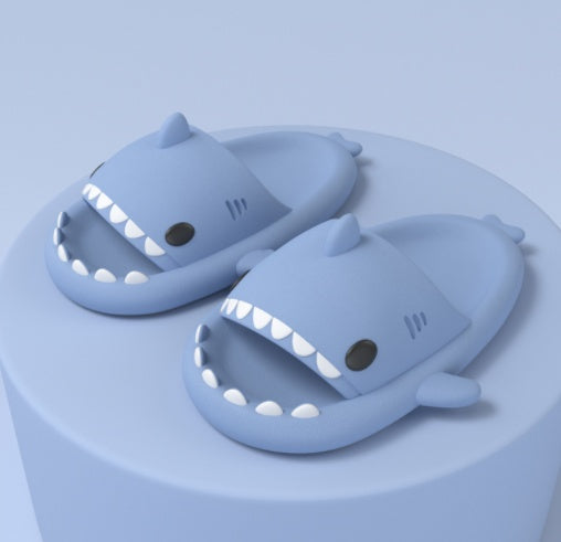 Cartoon shark slippers, light blue slide-on sandals with white teeth and fin accents