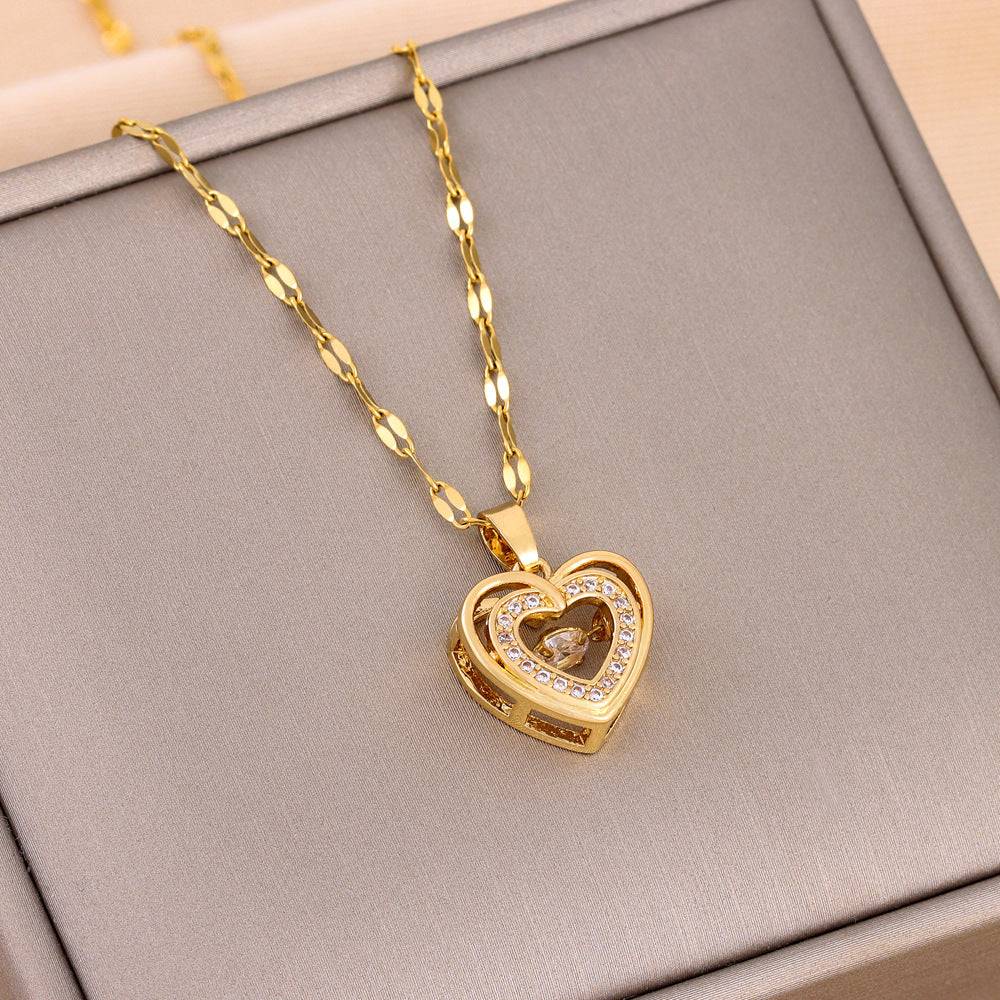 Double-layer love necklace with gold-toned heart pendant and rhinestone details