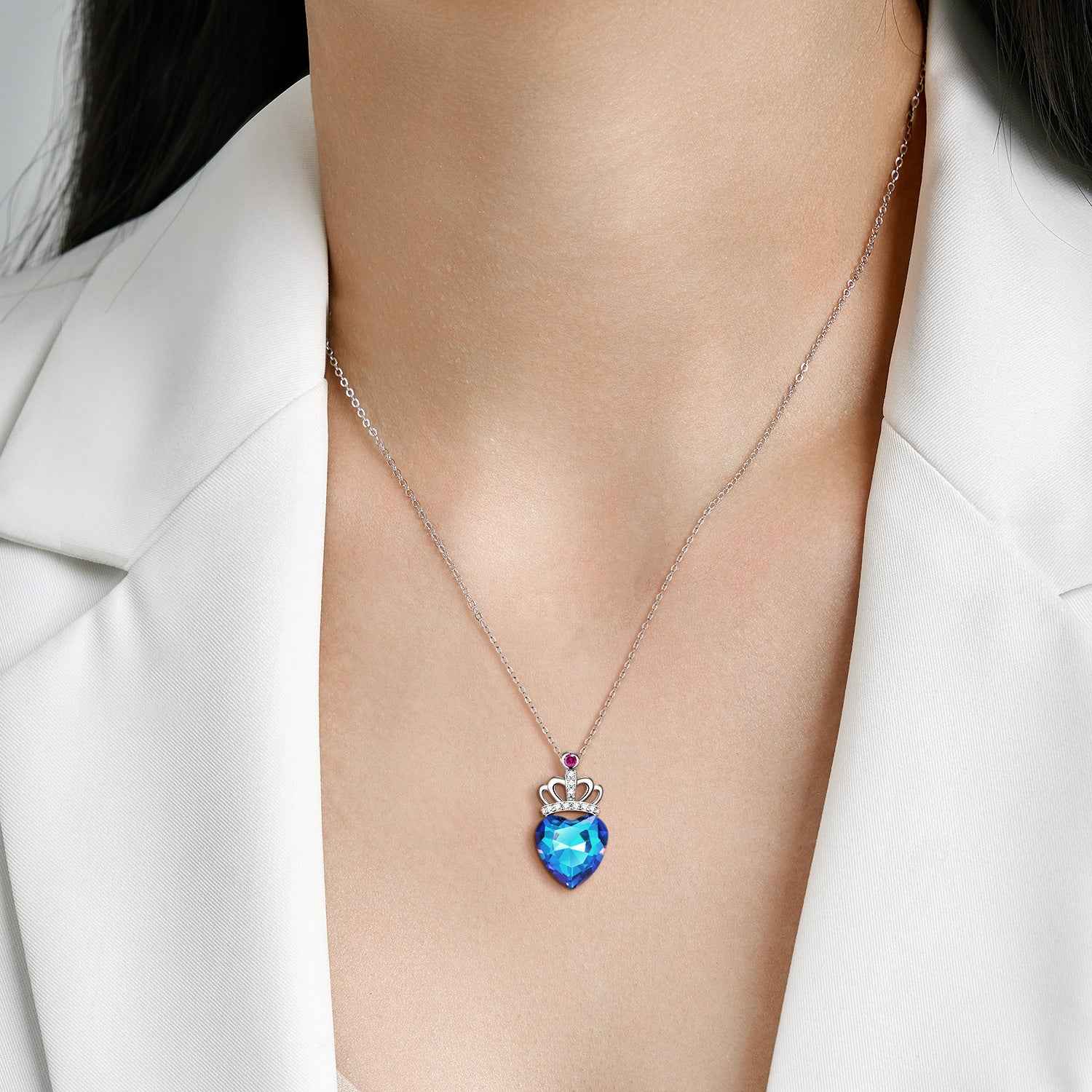Sterling silver heart pendant necklace on chain with blue faceted heart and pink top