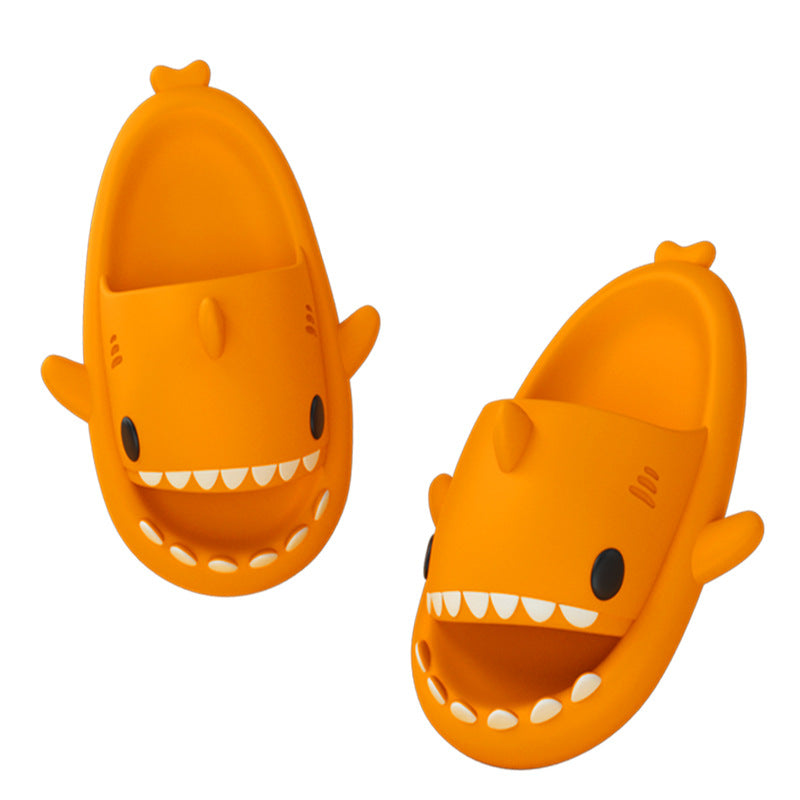Cartoon shark slippers pair in orange, open top with big cartoon teeth