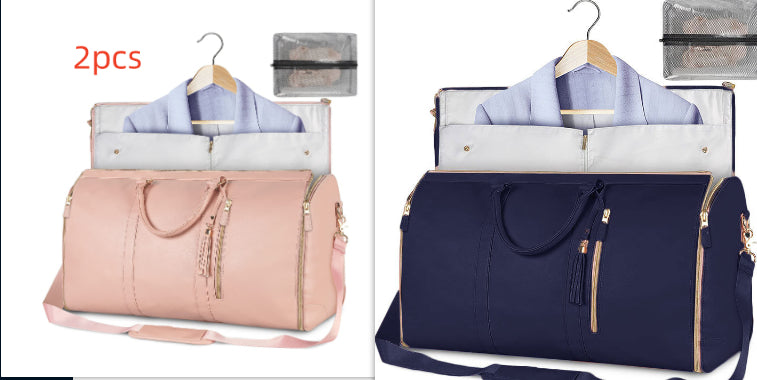 Blush pink and navy foldable travel duffle bags with front zippers and shoulder straps