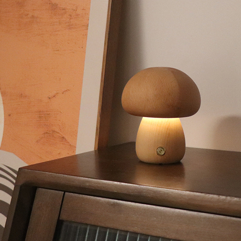 Wooden mushroom LED night light, light wood cap glowing warm in bedroom