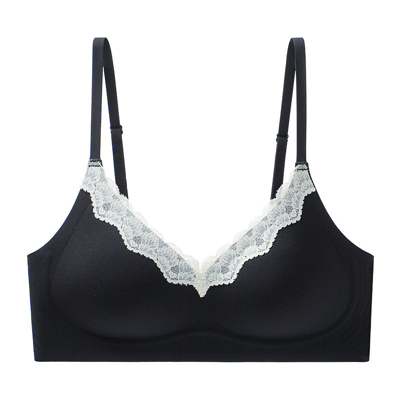V-neck lace seamless bra, black flat lay with white lace V-neck trim and adjustable straps