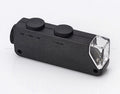 Black clip-on microscope magnifier with two top knobs and clear front lens window