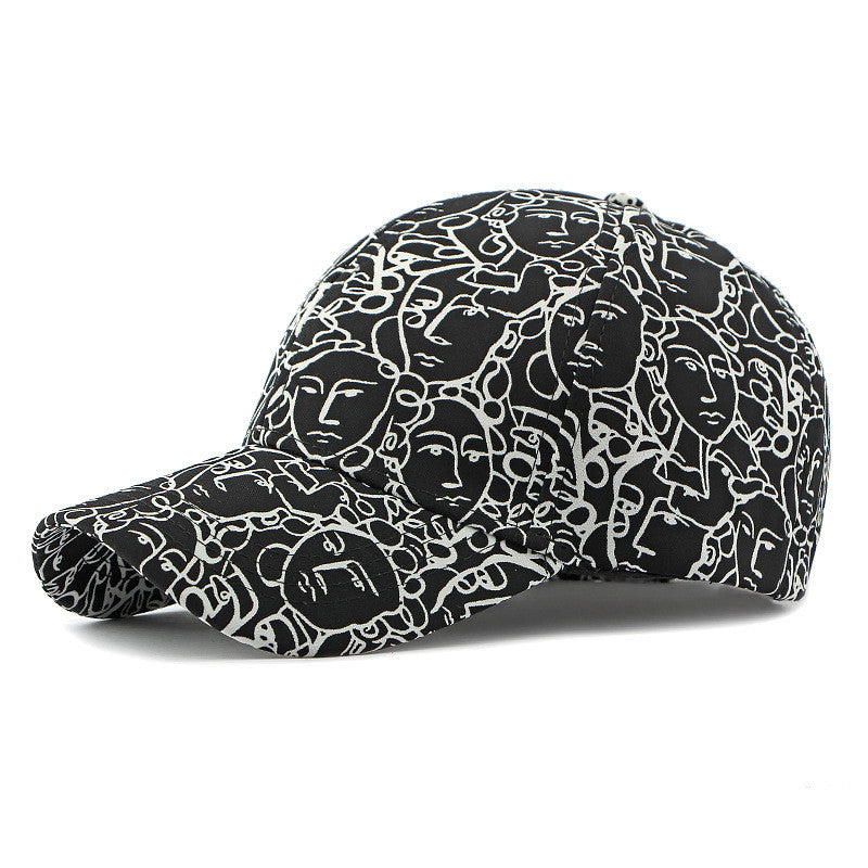 Black retro peaked cap with white face graffiti line pattern and curved brim